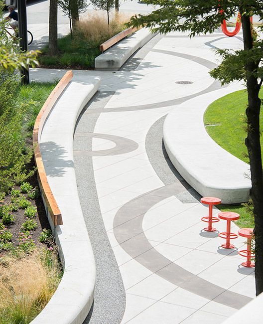A pathway with continous benches along the side